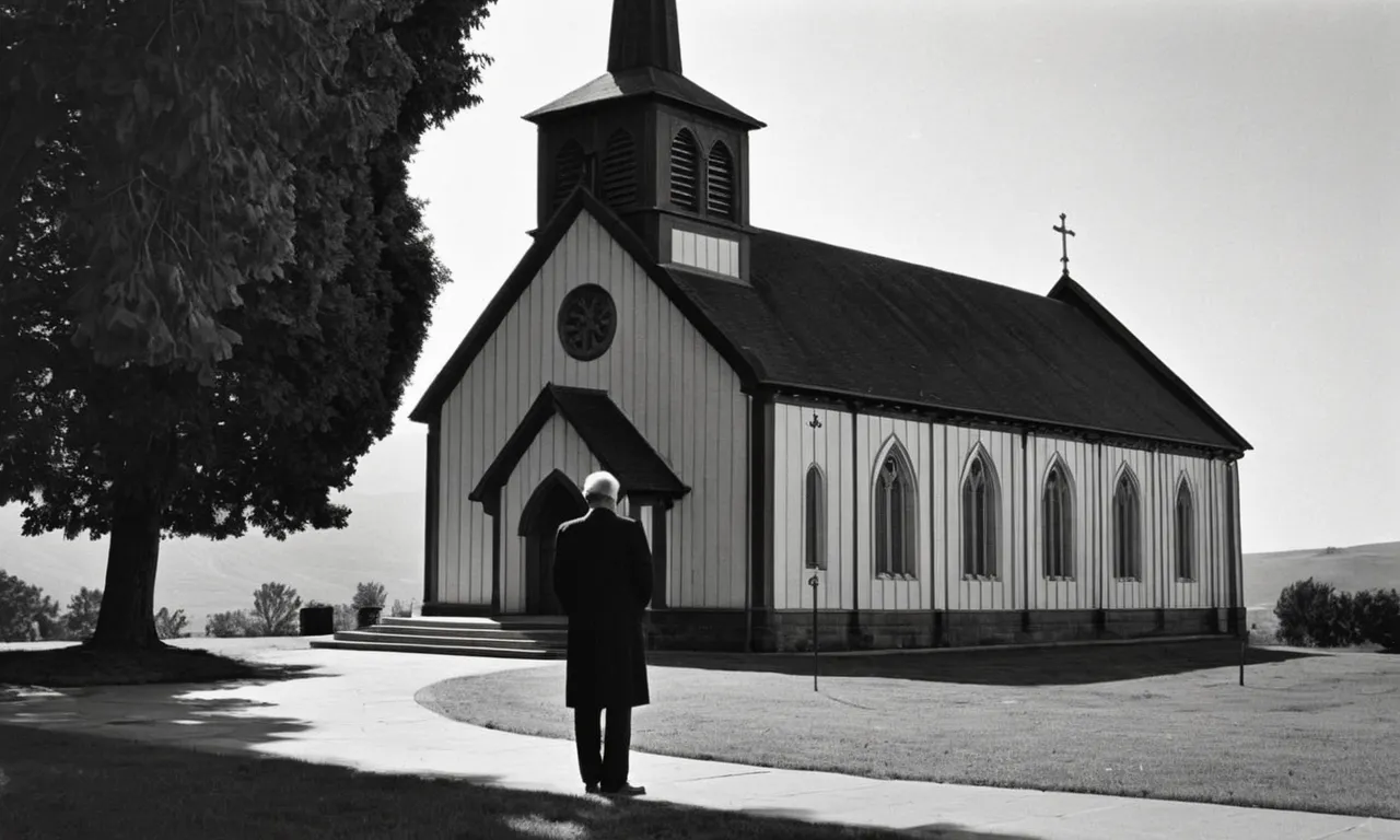 A black and white image captures a solitary figure, head bowed in front of a church, the somber surroundings symbolizing the eternal question: "Why did God allow sin?"