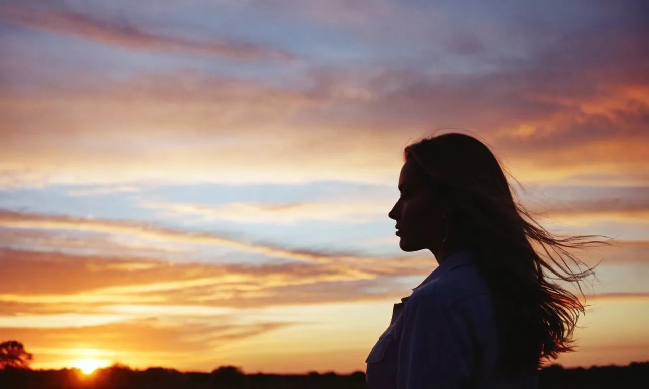 A photograph capturing a woman's silhouette against a vibrant sunset, symbolizing the beauty and purpose of Eve, reflecting God's intention for companionship and love.