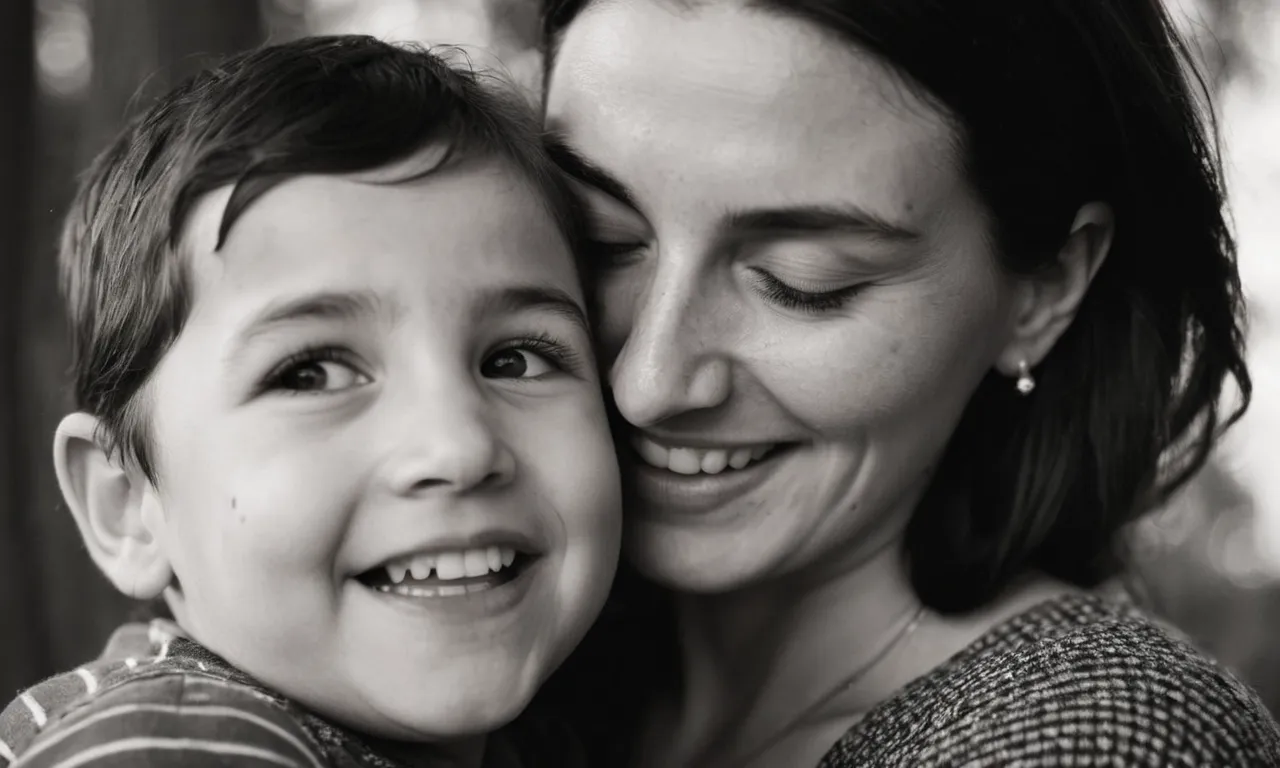 A tender, black-and-white photograph captures a mother's tear-streaked face, embracing her smiling autistic child, beautifully portraying the unbreakable bond forged amidst the complexities of life.