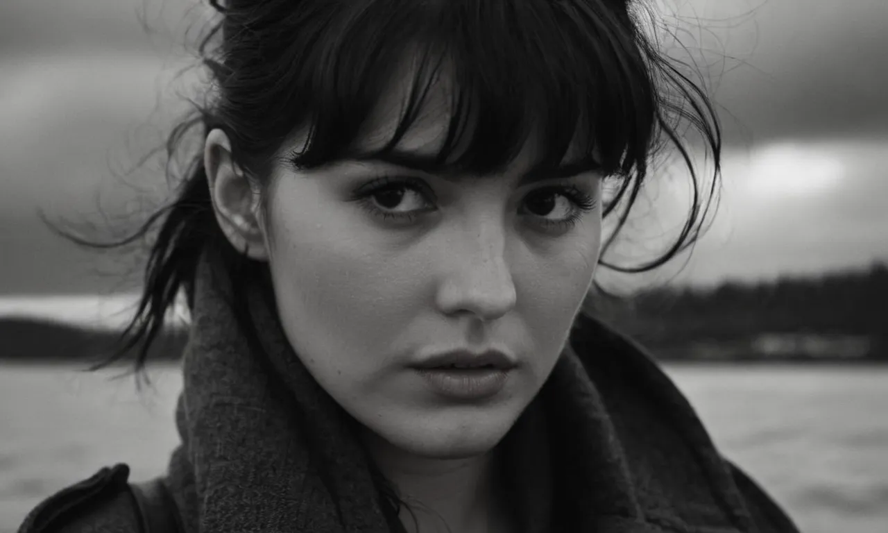 A black and white close-up portrait, capturing a tearful gaze against a stormy backdrop, symbolizing the pain and searching for answers when God takes our loved ones.