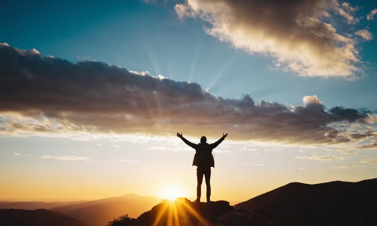A photograph capturing a person's silhouette standing on a mountaintop, arms outstretched, with a radiant sunset behind them, symbolizing the transformative and uplifting journey of following Jesus.