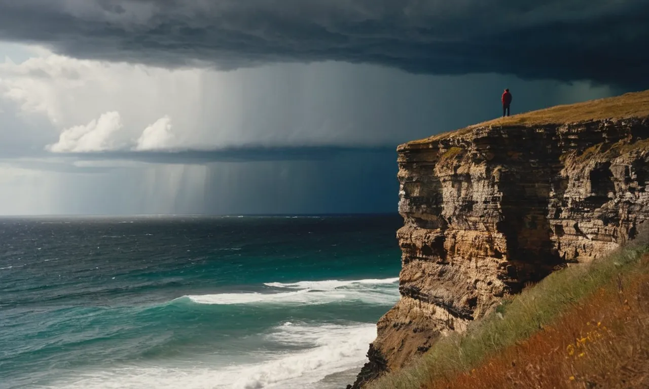 A solitary figure stands on a desolate cliff, gazing toward the vast ocean below as a storm brews overhead, capturing the existential question of "why is God keeping me alone?"