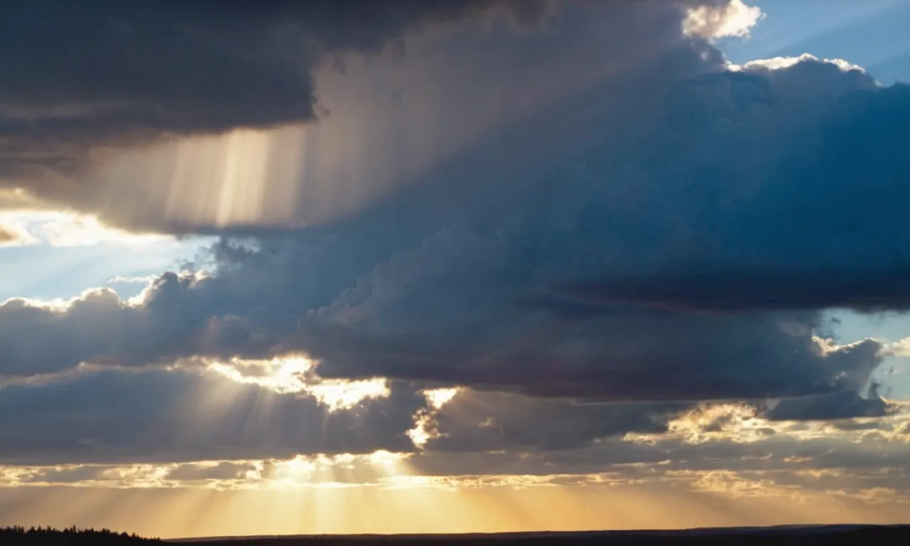 The photo captures a stunning sunset over a vast landscape, with rays of light breaking through the clouds. A bible lies open, highlighting the passage that addresses the question, "Why is God referred to as He?"