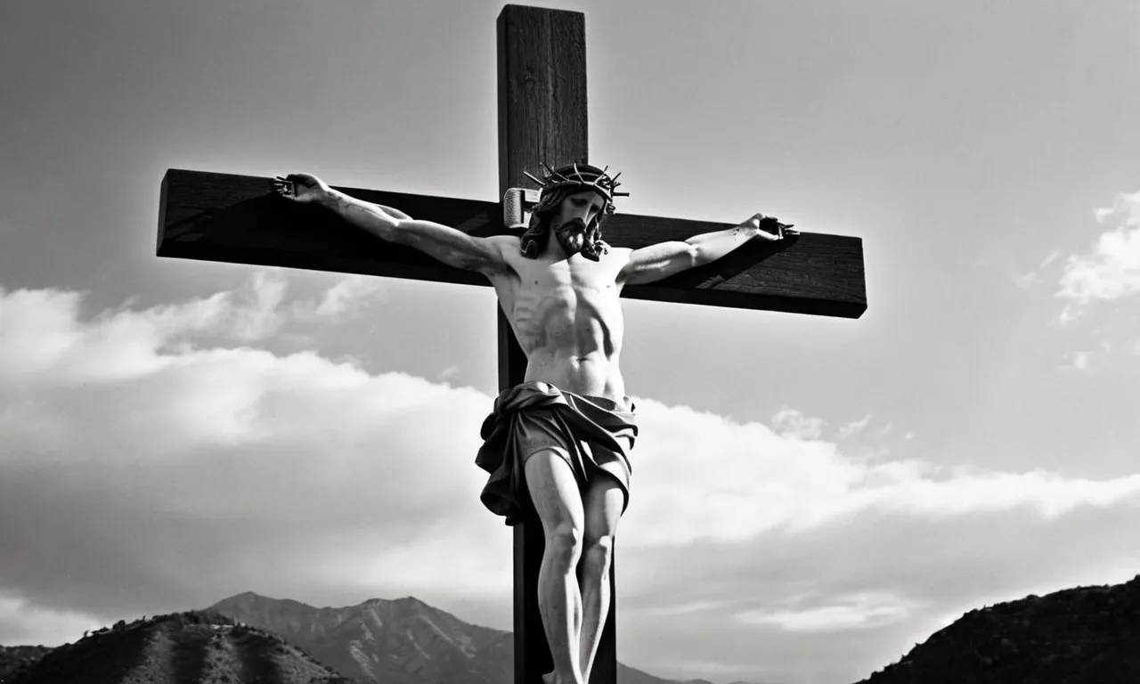 A black and white photograph capturing Jesus on the cross between two thieves, depicting the sorrow and sacrifice that unfolded on that fateful day.