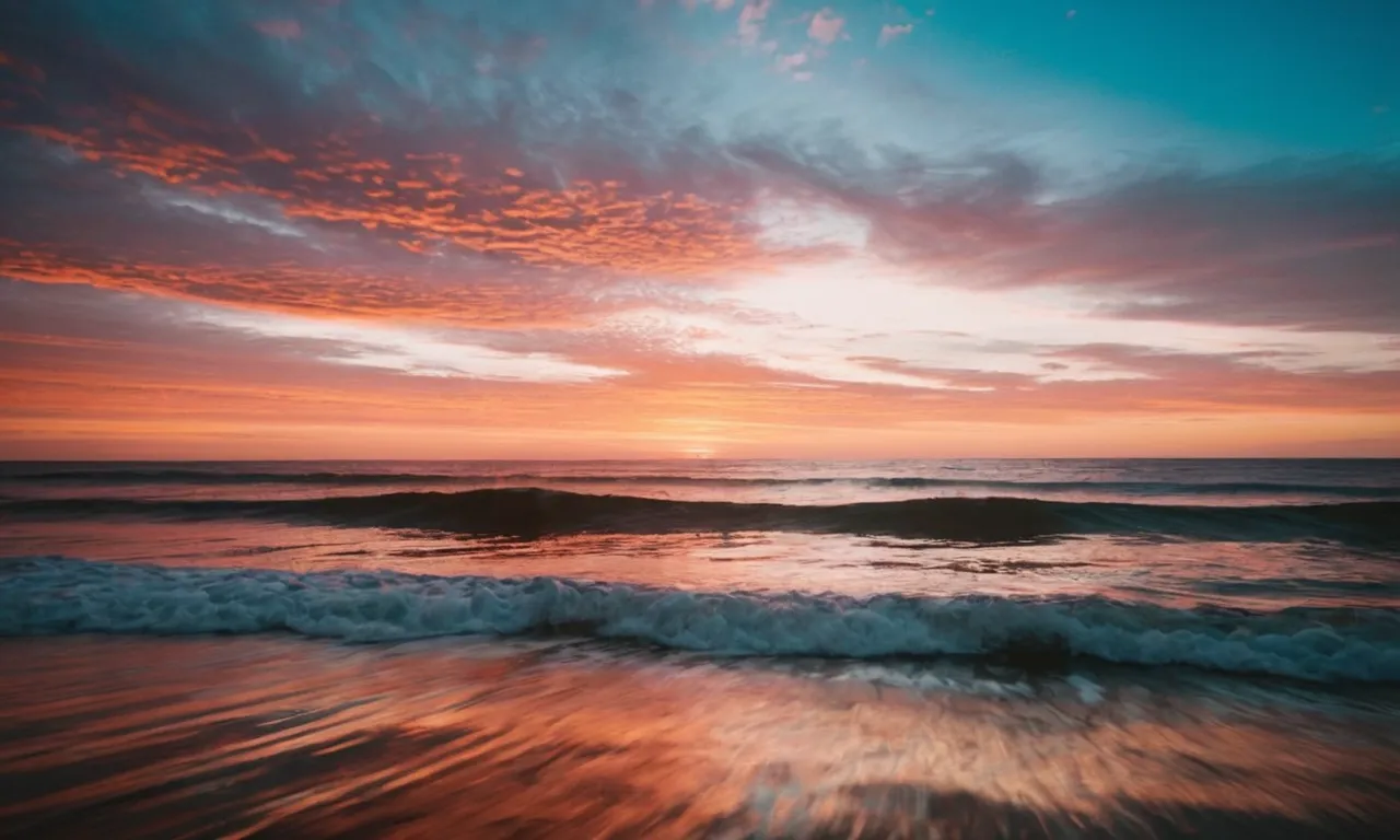 A serene image of a calm ocean at sunset, with vibrant hues of orange and pink, reflects the saying "why worry when God is in control."